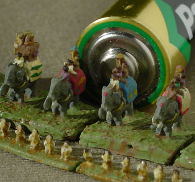 2mm scale elephants, with battery for scale.