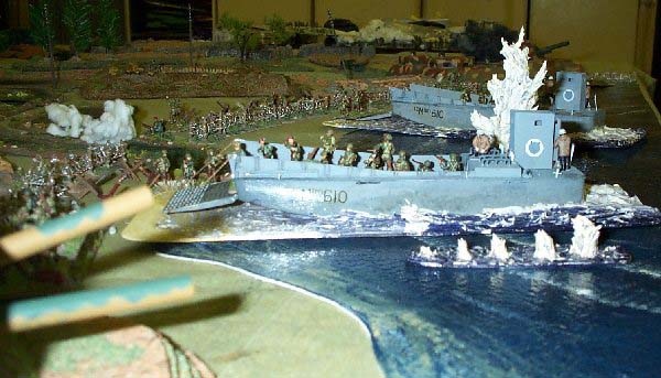 Paras rush aboard an LCM while Jerry's guns hamper the evacuation.